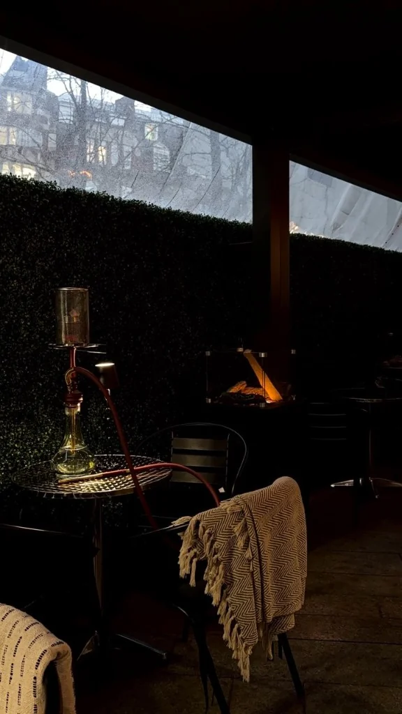 Quiet terrace seat with city glow beyond