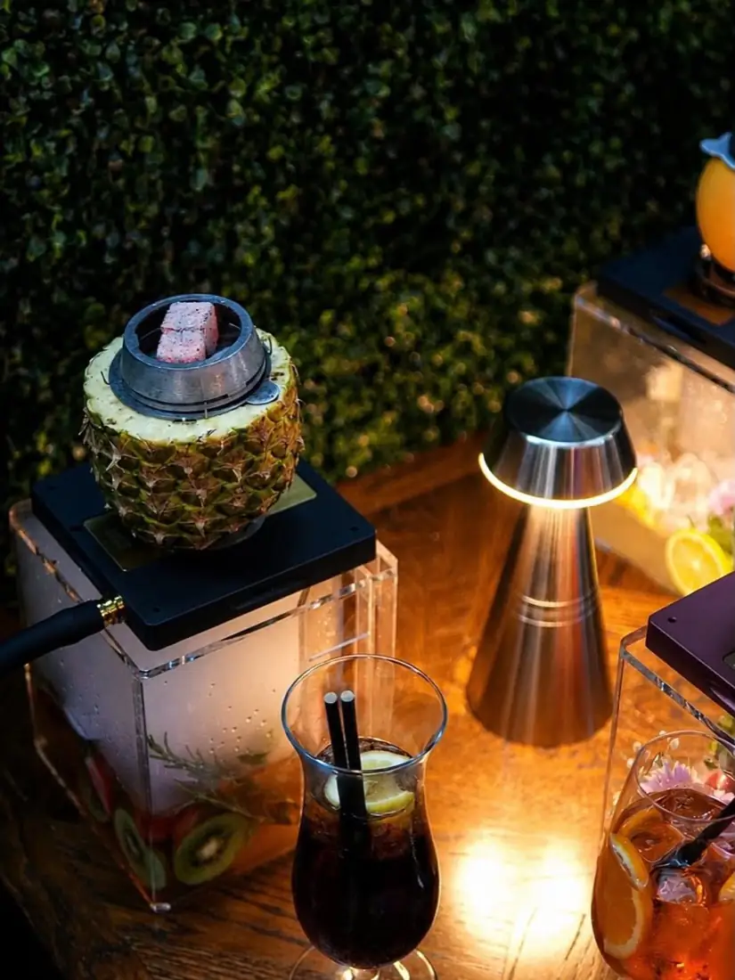 Pineapple bowl shisha with cocktails on the terrace