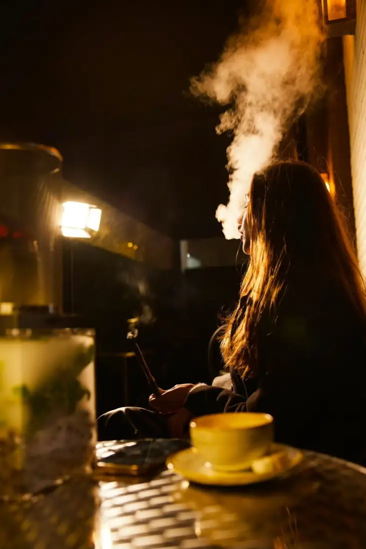 Shisha smoke on the O.S Smoke London terrace at night